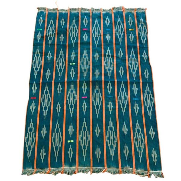 bashiri-indigo-cotton-245-damongo-african-cotton-fabric-woven-2 Full view of the green-blue cotton cloth with pale diamond motifs on a white background