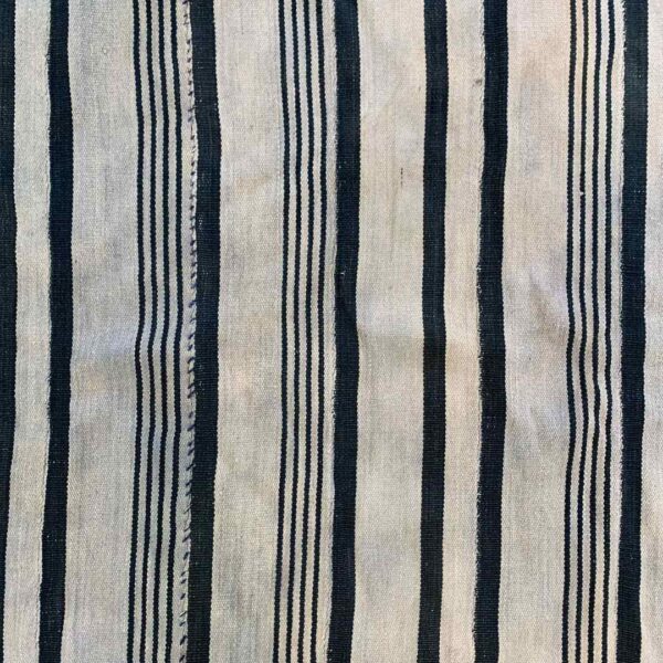 bashiri-indigo-cotton-247-sunyani-handwoven-african-fabric-3 Close-up of the pale cotton cloth with faded indigo stripes