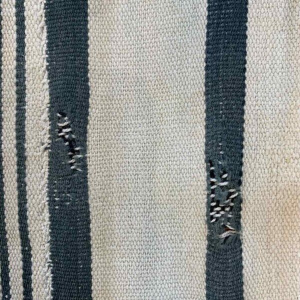 bashiri-indigo-cotton-247-sunyani-handwoven-african-fabric-4 Close-up of the pale cotton cloth with faded indigo stripes
