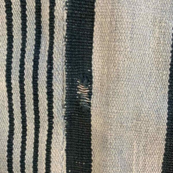 bashiri-indigo-cotton-247-sunyani-handwoven-african-fabric-5 Close-up of the pale cotton cloth with faded indigo stripes
