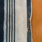 Close-up of the pale cotton cloth with faded indigo stripes