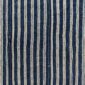 Close-up of the deep indigo cotton cloth with fine pale pinstripes