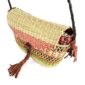 Close-up of the woven flap and leather toggle on the coral and green mini Bolga shoulder bag