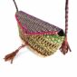 Close-up of the woven flap and leather toggle on the purple, pink, and green mini Bolga shoulder bag