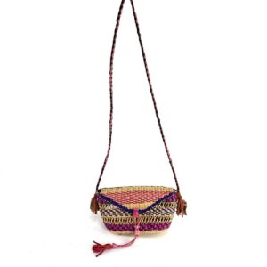 Full view of the pink and purple mini Bolga shoulder bag with its plaited strap and leather tassels