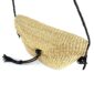 Close-up of the woven flap and leather toggle on the natural undyed mini Bolga shoulder bag