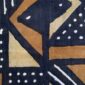 Close-up of the dark mudcloth with large warm-toned triangles and bow-tie shapes