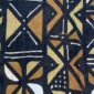 Close-up of the dark mudcloth with a grid of warm-toned and pale triangles