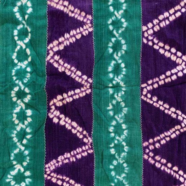 bashiri-mudcloth-small-148-monitor-bogolan-african-textile-3 Close-up of the mudcloth with jewel-toned strips and pale chain and zigzag patterns