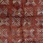Close-up of the red-earth mudcloth with pale crossed diamond motifs