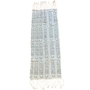 bashiri-mudcloth-small-152-firefinch-bogolan-african-textile-2 Full view of the small light mudcloth with a grid of dark stars and chevrons on a white background