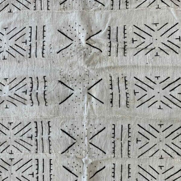bashiri-mudcloth-small-152-firefinch-bogolan-african-textile-3 Close-up of the light mudcloth with a grid of dark stars and chevrons