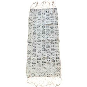bashiri-mudcloth-small-153-hoopoe-bogolan-african-fabric-2 Full view of the small light mudcloth with rows of dark circles and crosses on a white background