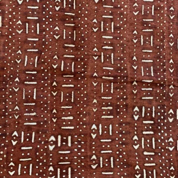 bashiri-mudcloth-small-155-wheatear-african-mud-cloth-fabric-3 Close-up of the red-earth mudcloth densely patterned with pale dashes and dots