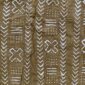 Close-up of the muted earth-toned mudcloth with panels of pale crosses and chevrons