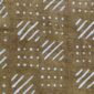 Close-up of the muted earth-toned mudcloth with pale diagonal stripes and dots