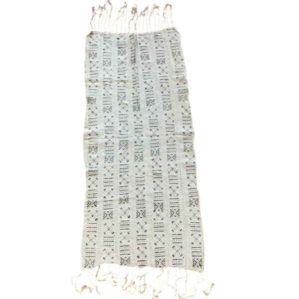 bashiri-mudcloth-small-159-cricket-african-mud-cloth-fabric-2 Full view of the small light mudcloth with columns of dark crosses and cowrie shapes on a white background