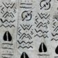Close-up of the light mudcloth with dark zigzags and cowrie shapes