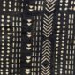Close-up of the dark mudcloth with columns of pale chevrons and triangles