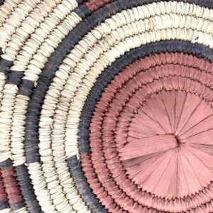 bashiri-placemat-180-blossom-woven-raffia-platter-2 Close-up of the coiled raffia weave and centre of the rust, black and natural Burkina platter with a block pattern