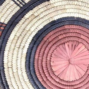 bashiri-placemat-183-flourish-african-platter-raffia-2 Close-up of the coiled raffia weave and centre of the rust, black and natural Burkina platter with a concentric pattern