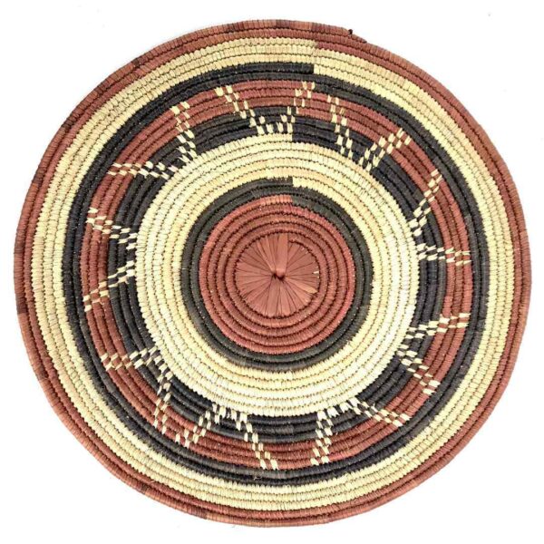 bashiri-placemat-186-vibrance-burkina-platter-woven-3 Full view of the rust, black and natural Burkina platter with a zigzag pattern on a white background