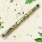 Bamboo rainstick 100cm with hand-painted black and natural dragonfly motif on white background.