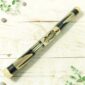 Bamboo rainstick 60cm with hand-painted black and natural turtle motif on white background