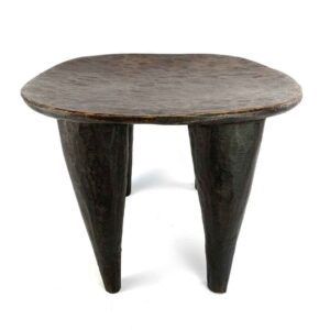 Front view of the dark hardwood Senufo stool with a rounded square seat on a white background