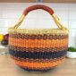 XL round Bolga basket handwoven from elephant grass in orange and black pattern with leather handle, Bolgatanga Ghana