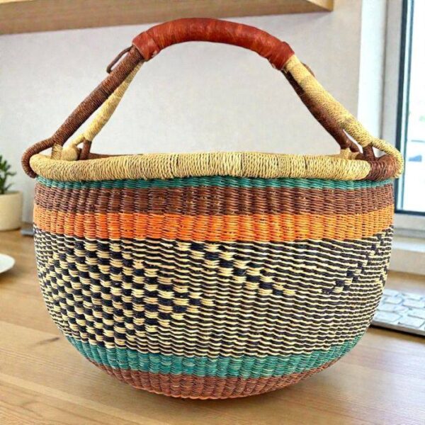 bashiri-xl-round-bolga-basket-teal-orange XL round woven Bolga basket in teal, orange and natural elephant grass with leather handle, handcrafted in Bolgatanga Ghana