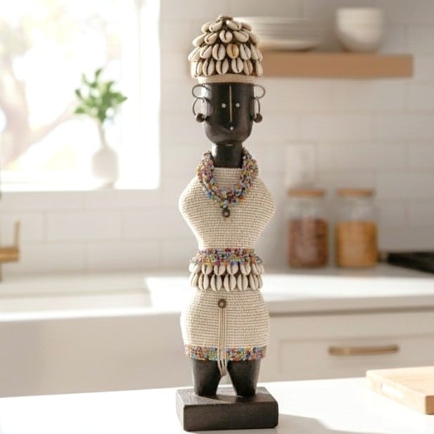 Beaded African statue with cowrie shell headdress, carved wood figure with beadwork bodice and belt