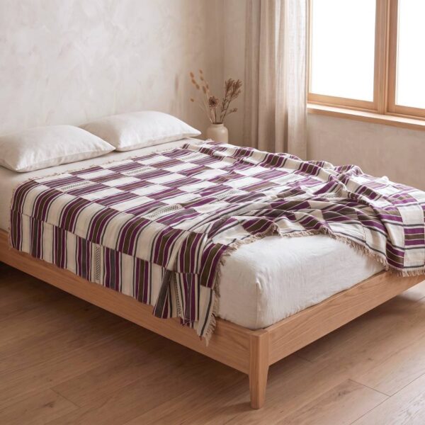 handwoven sahel blanket used as a bed cover