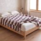 handwoven sahel blanket used as a bed cover