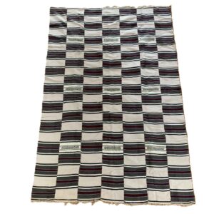 Detail of the striped pattern of varying width with an open-weave band on this handwoven Sahel cotton blanket