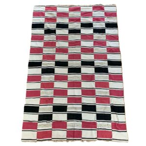 Detail of the checkerboard block pattern framed by pinstripes on this handwoven Sahel cotton blanket