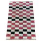 Detail of the checkerboard block pattern framed by pinstripes on this handwoven Sahel cotton blanket