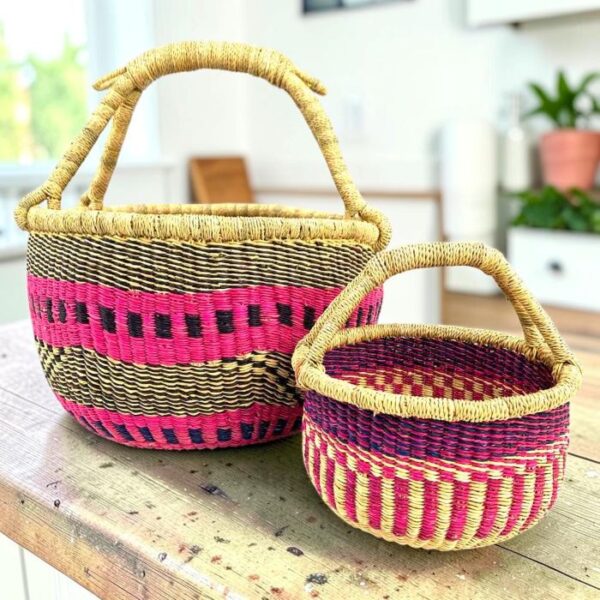bolga-basket-round-duo-hot-pink-navy-bashiri Round Bolga basket duo in hot pink and navy elephant grass with natural handles
