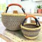 Round Bolga basket duo in navy and natural elephant grass with leather handles
