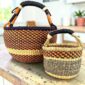 Round Bolga basket duo in orange and black elephant grass with wrapped handles