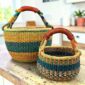 ound Bolga basket duo in teal, orange and green elephant grass with leather handles