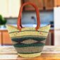 Long handle market basket with a geometric diamond band in deep, cool tones and leather-wrapped handles