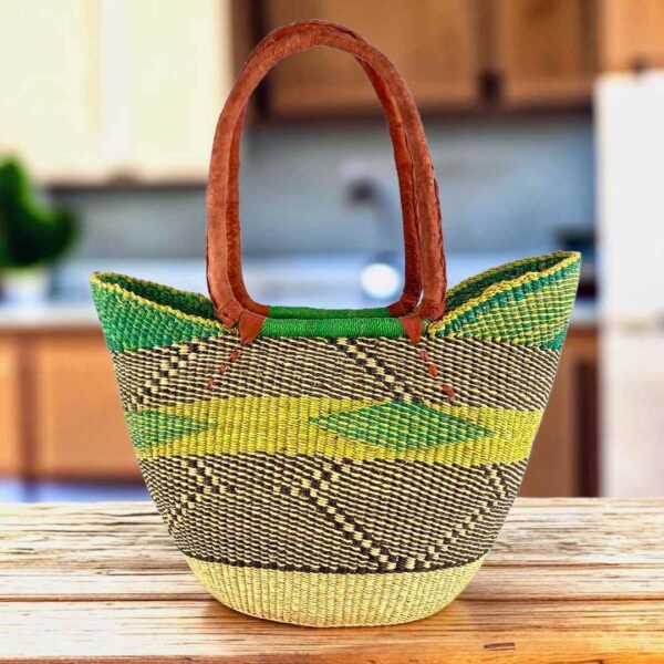 Long handle market basket with a zigzag pattern in fresh, bright tones and leather-wrapped handles
