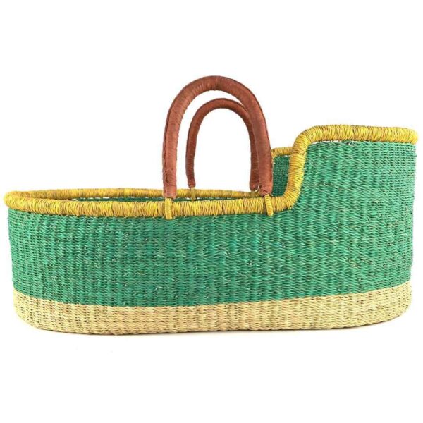 bolga-moses-basket-175-whisper-green-african-bashiri-3 Front view of the Moses basket with a solid green body, yellow rim, natural base and leather-wrapped handles on a white background