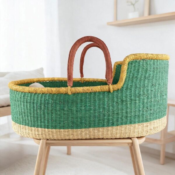 bolga-moses-basket-175-whisper-green-african-bashiri-main Moses basket with a solid green body, yellow rim, natural base and leather-wrapped handles