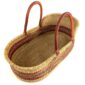 Angled view of the natural Moses basket showing the rust zigzag band and woven base