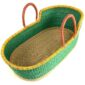 Angled view of the green Moses basket showing the woven base inside