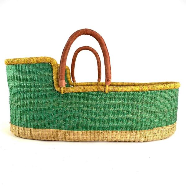 bolga-moses-basket-179-softness-green-elephant-grass-african-basket-bashiri-3 Front view of the green Moses basket with a natural base, yellow rim, and leather handles