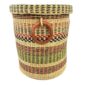 Front view of the closed laundry basket with natural straw with pink, green and black bands, a woven lid and leather ring handles on a white background