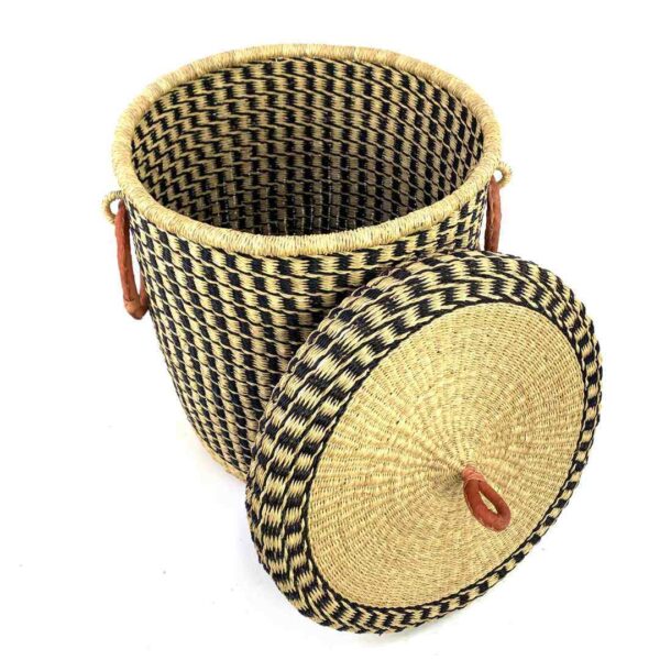 closed-laundry-basket-0307-jones-black-natural-woven-bashiri-2 The closed laundry basket with its lid off, showing a black and natural check, a woven lid and leather ring handles